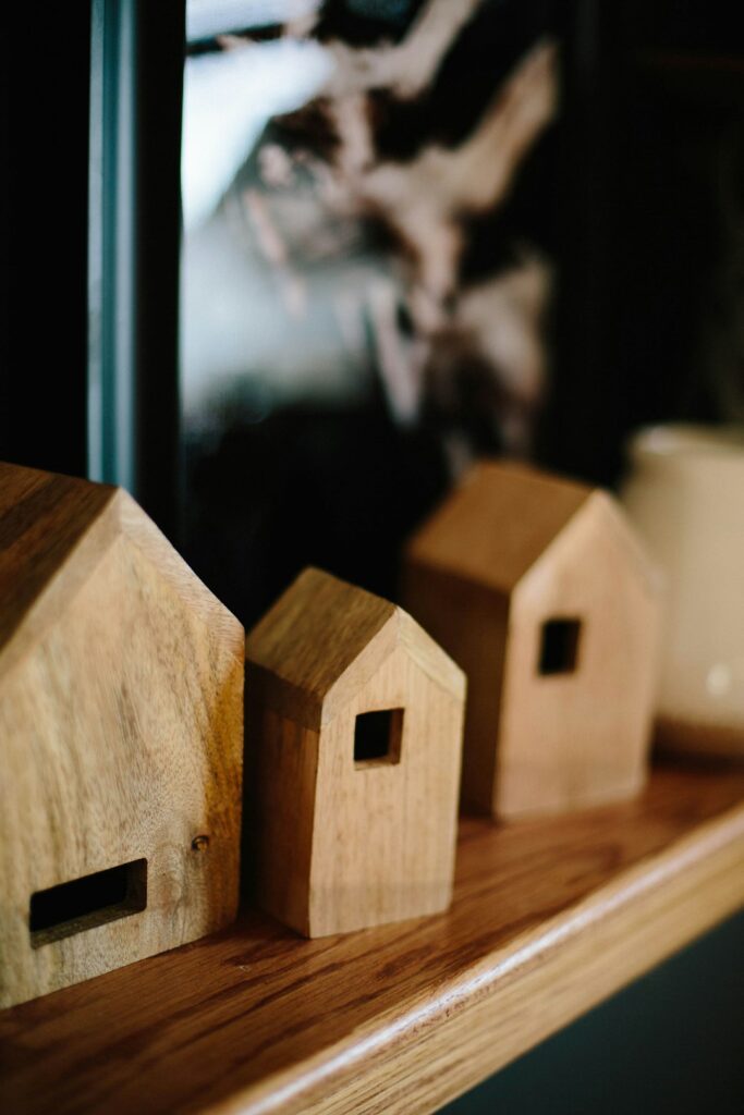 shallow-focus-photo-of-brown-wooden-house-miniature-dd86h8l4ttw